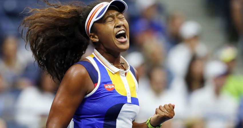 Naomi Osaka celebrates during her first round match (Getty)