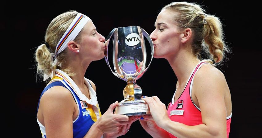 Andrea Hlavackova and Timea Babos with the Martina Navratilova Trophy (Getty)