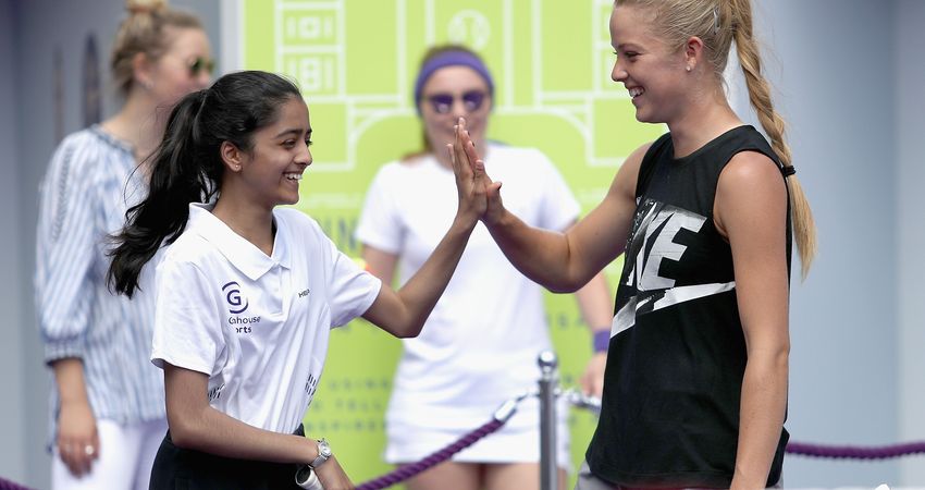 Rising star Katie Swan greets a young fan. (Getty Images)