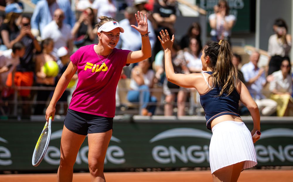 Doubles love it: Barbora Krejcikova gives a lucky fan some doubles tips at Saturday's Kids Day.
