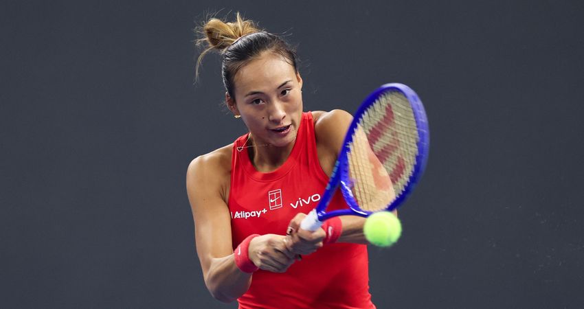 Zheng Qinwen returning a ball in the 2026 Beijing China Open