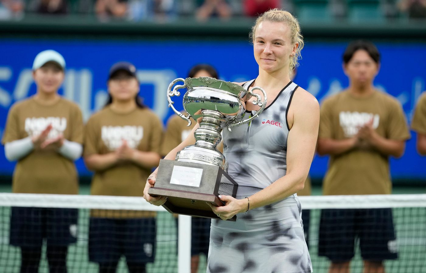 Katerina Siniakova holding her 2026 Japan Open singles trophy