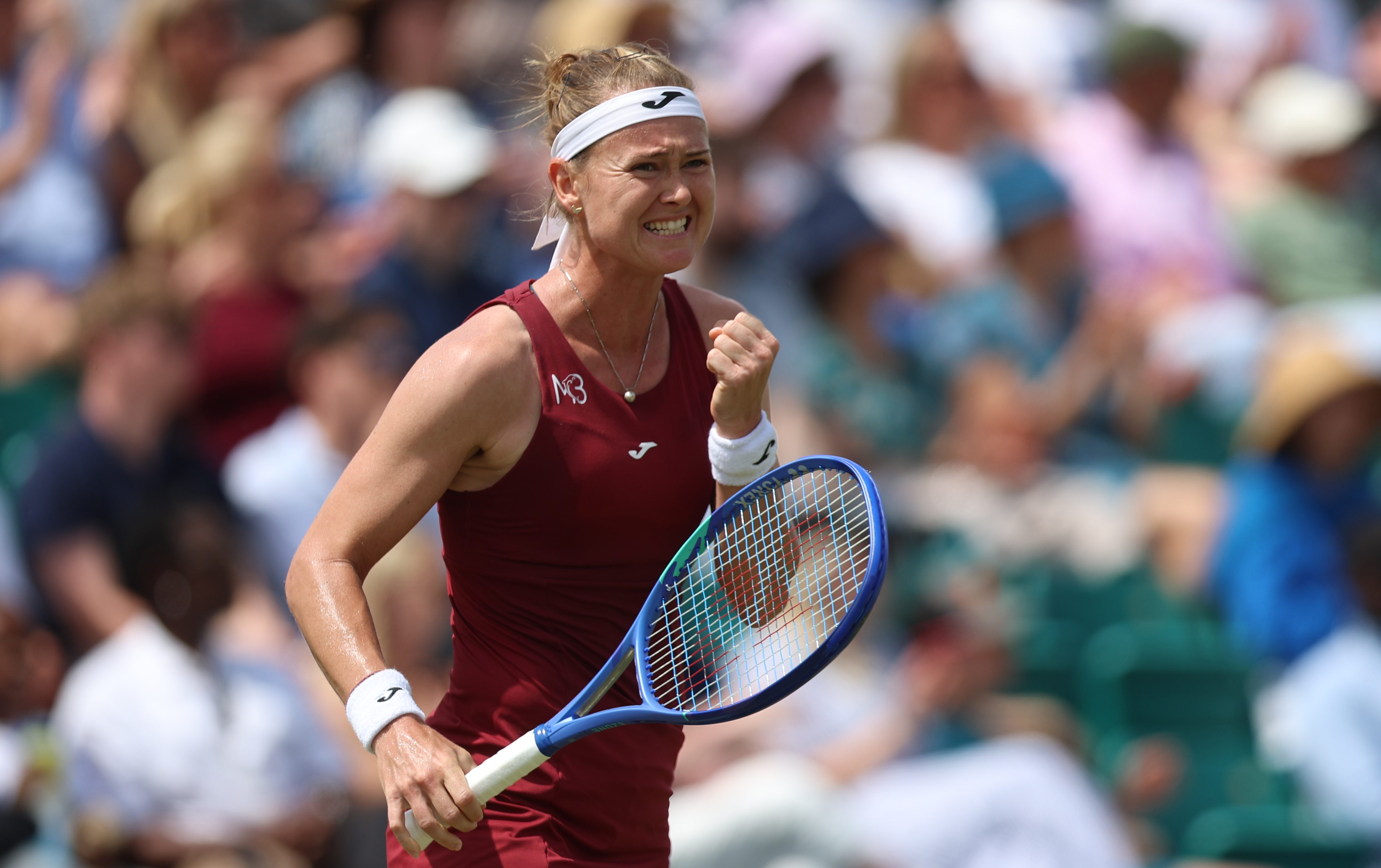 Bouzkova grinds through longest final for first grass title