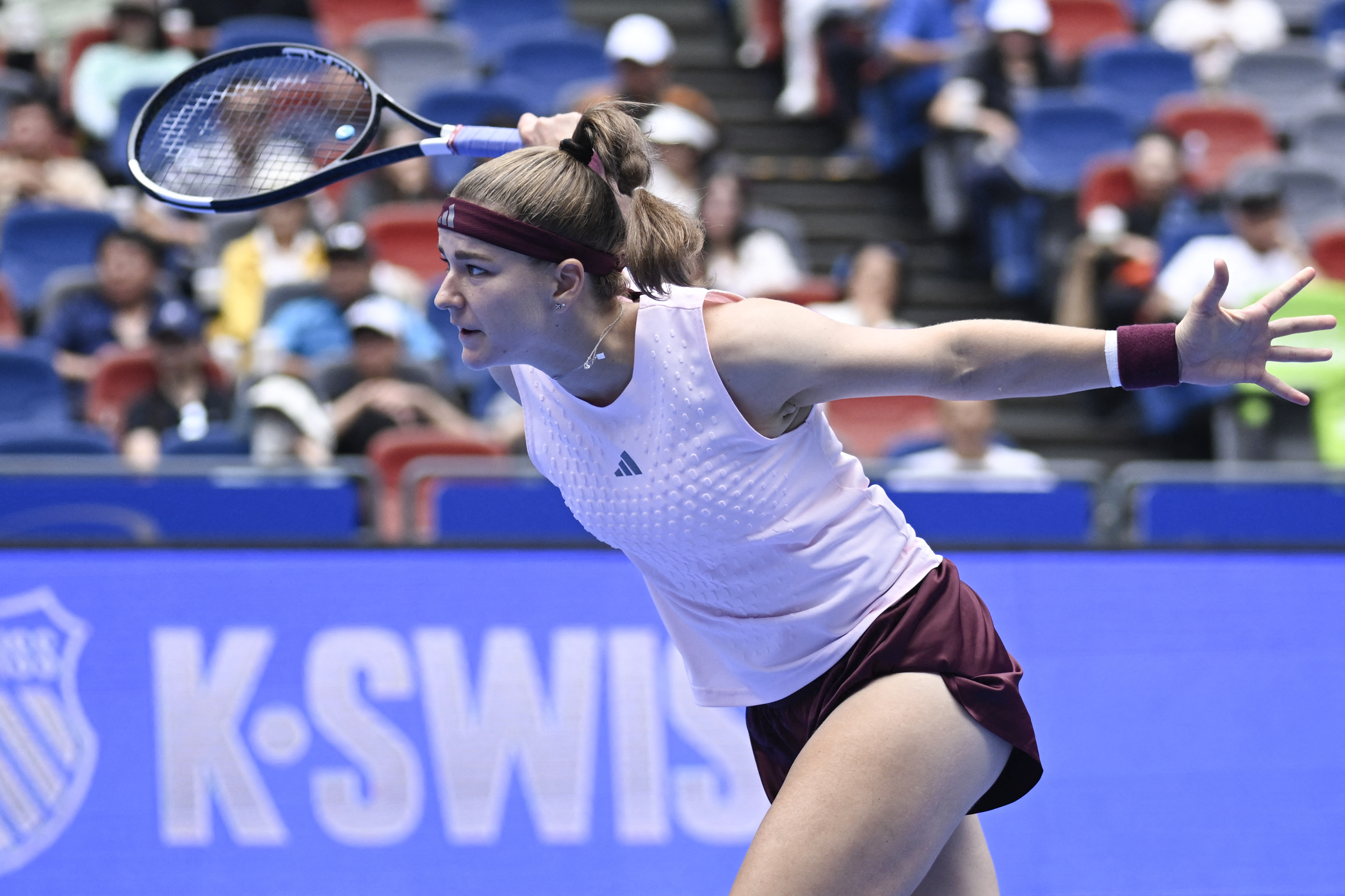 Hot shot: Karolina Muchova's leaping behind-the-back overhead in Wuhan